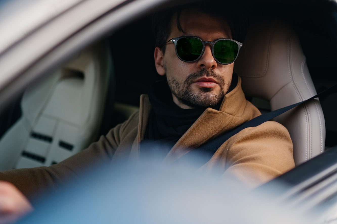 Andrea Mazzuca photoshoot with Roveri Eyewear CLM7 BRICK, gold titanium frame and green Zeiss lenses, in Ferrari F12 in Milan, Italy, for the new sunglasses carbon-collection.